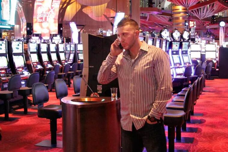 One lone gambler , Bill Cruise of Brooklyn, was alone on the gaming floor of Revel Casino just before midnight on Nov. 30. ELIZABETH ROBERTSON / Staff