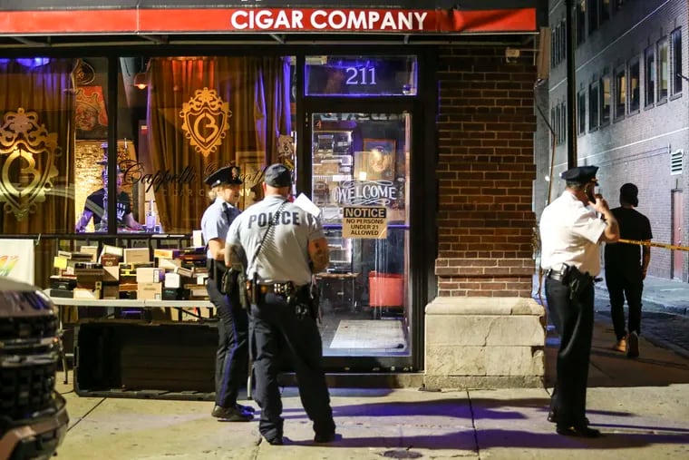 Police on the 200 block of South 13th Street where a man was shot in the leg inside a cigar shop, Friday, June 17, 2022.