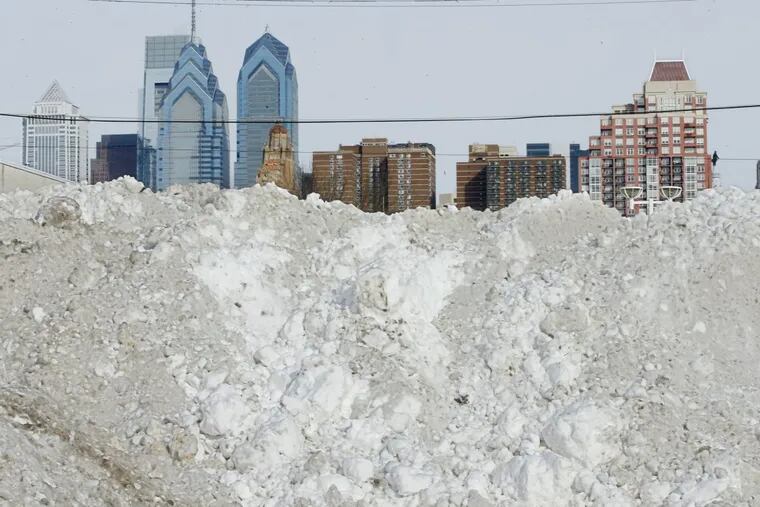 City snow pile in South Philly after 2016 storm; feds say odds favor above-normal temperatures this winter.
