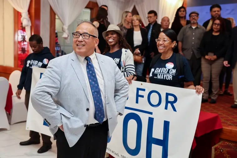 Republican mayoral candidate David Oh gathers attendees on stage for a group photo during a campaign event at Grand Palace Restaurant in Philadelphia, Pa. on Monday, Sept. 25, 2023. Oh will face Democratic candidate Cherelle Parker in the mayoral election on November 7.