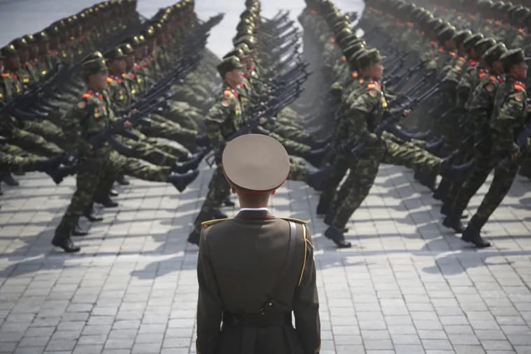 Soldiers goose-step across Kim Il Sung Square in Pyongyang, North Korea, during a parade in April.