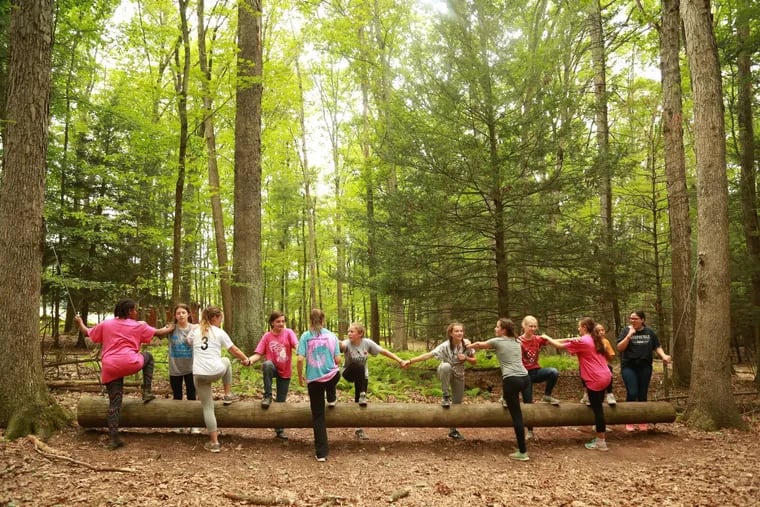 Members of the Girl Scouts of Eastern Pennsylvania take part in a group activity at Girl Scouts' Camp Wood Haven.