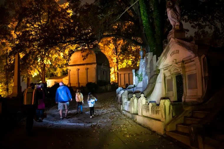 Guests of Laurel Hill East Cemetery walk the Full Moon Soul Crawl with a tour guide, learning of the rich history and people who are buried underneath.
