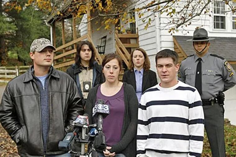 James Milliner, front row left; his girlfriend, Laura Peperato; and Paul Bartholomew discuss the killing of their two dogs. Also attending the news conference are, from left in the back row: Cheryl Shaw, humane society police officer; Cara McCree, a corporal with the state police; and Corey Manthei, a state police trooper. (Michael S. Wirtz / Staff Photographer)
