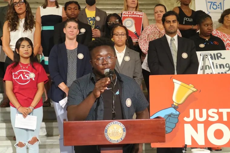 Paul Vandy, a senior at Penn Wood High School in Delaware County, speaks at a Harrisburg rally. Vandy attends school in the William Penn School District, one of the petitioners in a lawsuit alleging Pennsylvania's system of school funding is inadequate and violates the state constitution.