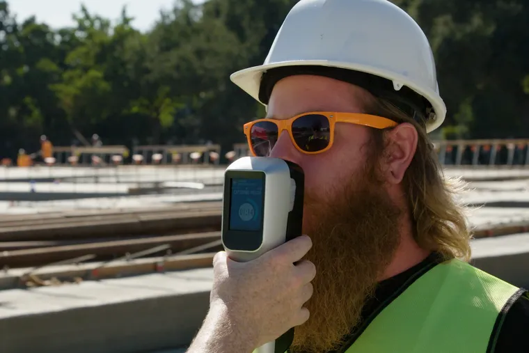 Release the Hound. Hound Labs, backed by Philadelphia hedge fund Intrinsic Capital Partners, expects to launch a breathalyzer in early 2020 that can detect whether someone has consumed marijuana within three hours. In this photo, a construction worker blows into the handheld device.