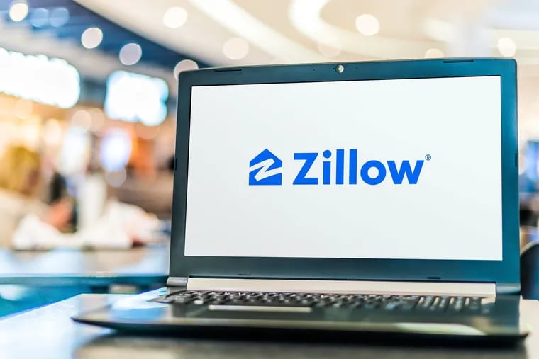 Seattle-based Zillow announced the cooling housing market and other factors led to financial losses, forcing the company to shut down its home-flipping division and lay off staff. (Dreamstime/TNS)