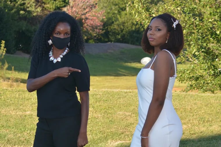 Metro Columnist Jenice Armstrong (left) at her niece's scaled-down backyard wedding in North Carolina on Sunday.