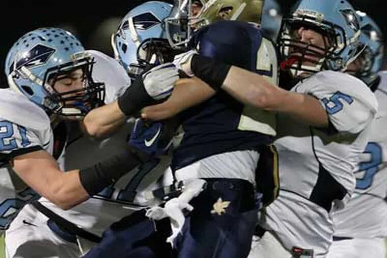 North Penn's defense stops Council Rock South's Anthony Alimenti during the 2nd quarter. (Steven M. Falk /Staff Photographer)