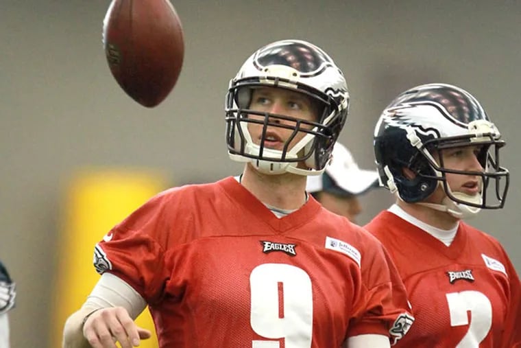 Nick Foles tosses a ball during practice at the NovaCare Complex. (David Swanson/Staff Photographer)
