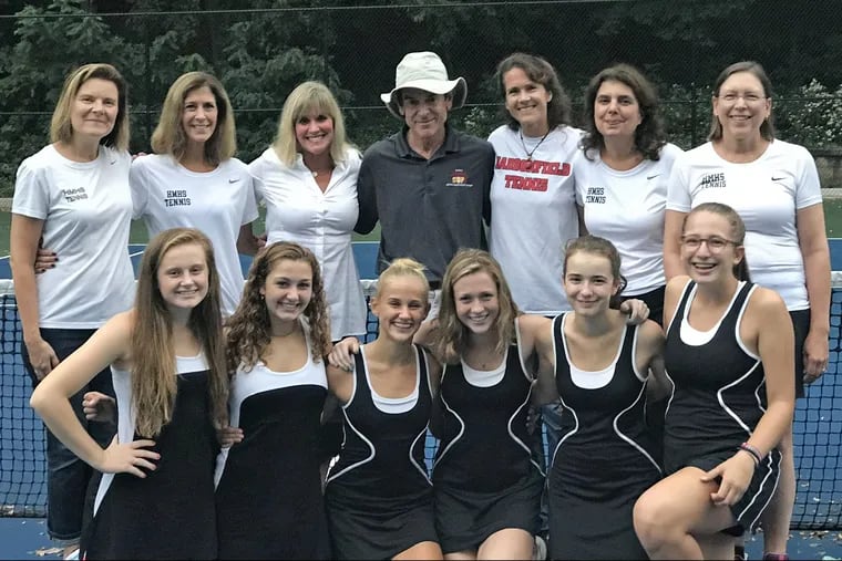 The Haddonfield moms and daughters with tennis coach Jeff Holman. Back row (from left) has Susan Parks, Karen Wallace, Susan Hodges, Holman, Deb Whiting, Joana McDonnell and Phoebe Figland. Bottom row has players (from left) Molly Parks, Lily Hanna, Paige Hodges, Becca Whiting, Alexandra McDonnell, and Gillian Rozenfeld.
