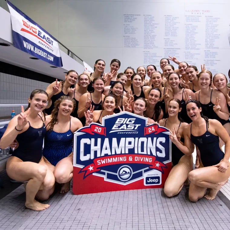 Villanova's swimming and diving team poses for its 11th consecutive Big East title at the Indiana University Natatorium in Indianapolis earlier this year.