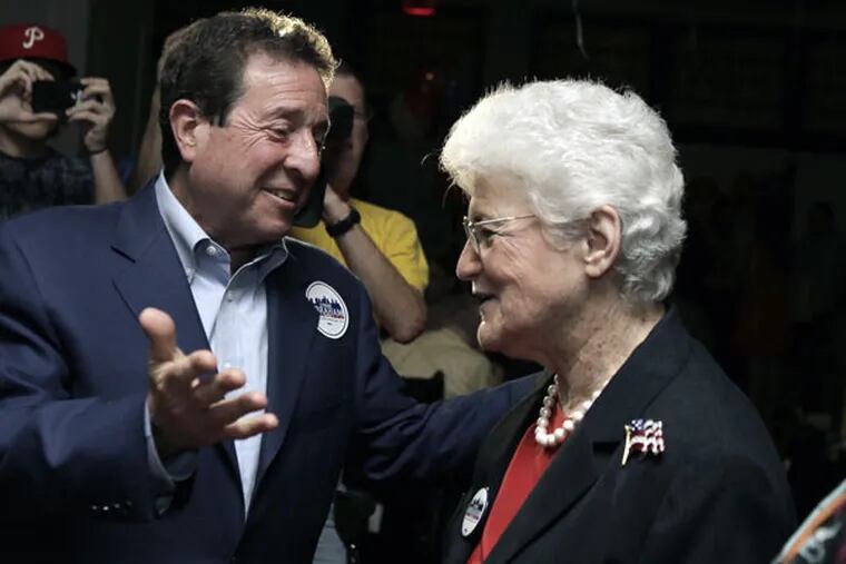 Lynne M. Abraham greets supporters, including lawyer Jon C. Sirlin, on election night at the Olde Bar. “I’m the second woman in 334 years to run for mayor. That’s a disgraceful record,” she said. (ELIZABETH ROBERTSON / Staff Photographer)