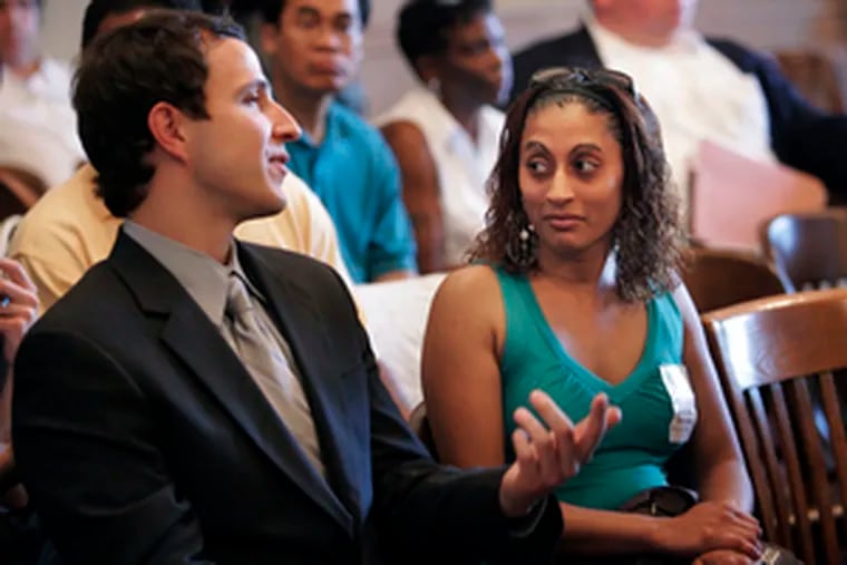 Lawyer volunteer Eric Vath talks with client and homeowner Shanazz Dabydeen during the Phila. court pilot program.