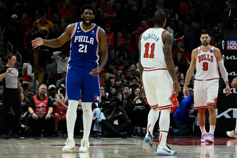 Sixers center Joel Embiid (21) reacts after scoring a three-point basket to give his team the lead in their win over the Chicago Bulls.