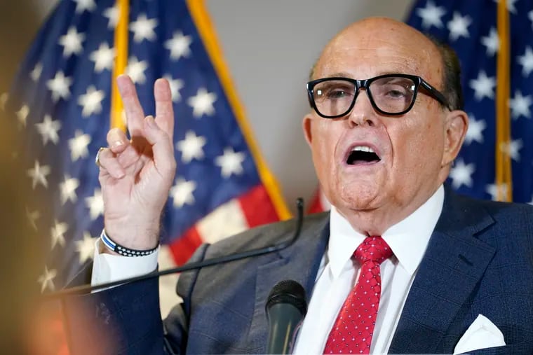 Former Mayor of New York Rudy Giuliani, a lawyer for President Donald Trump, speaks during a news conference.