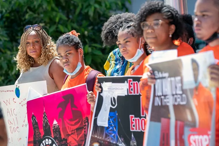 City Councilmember Jamie Gauthier (left) stands with students during a rally against gun violence at City Hall in Philadelphia on Tuesday, May 31, 2022. Students from nine Philly schools held a rally demanding answers and more support for young people around the effects of gun violence.