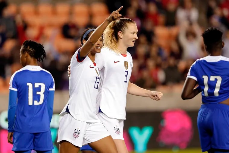 The United States' Lynn Williams (13) and Samantha Mewis (3) celebrate Williams' goal against Haiti during the second half.