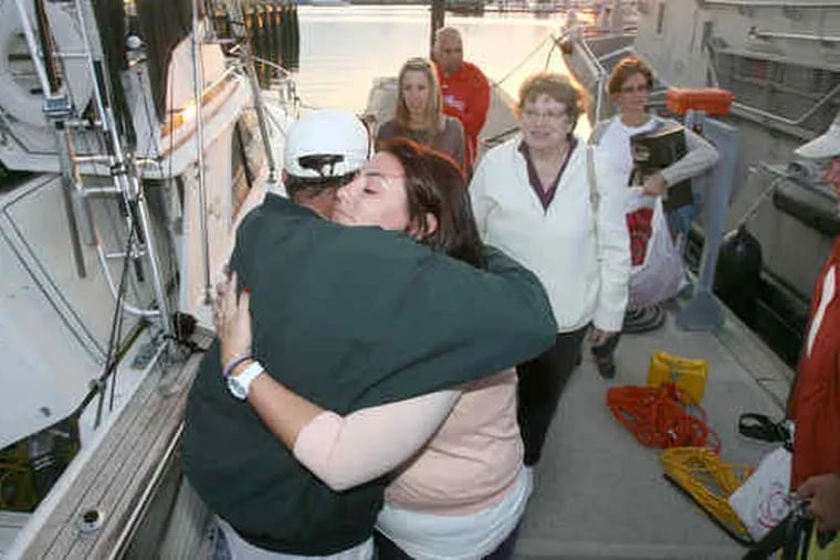 Bernie Otremsky is hugged by his daughter Erin as family members of the rescued men look on. Before their rescue, the mem had feared the worst: &quot;We kept quiet about it, but we were all thinking it, that this was probably going to be the end,&quot; said one, Geoffrey McDade.