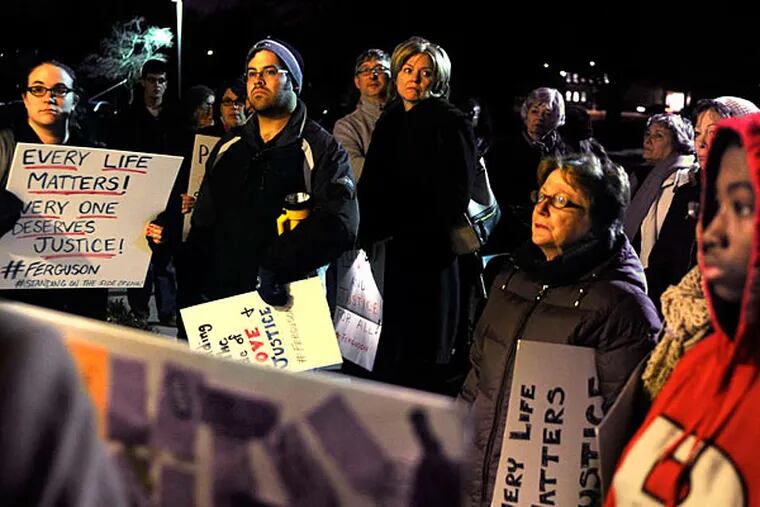 On Kings Highway in Cherry Hill, Unitarian Universalist Church members stand in solidarity with Ferguson residents protesting the grand jury finding in Michael Brown's death. (TOM GRALISH / Staff Photographer)