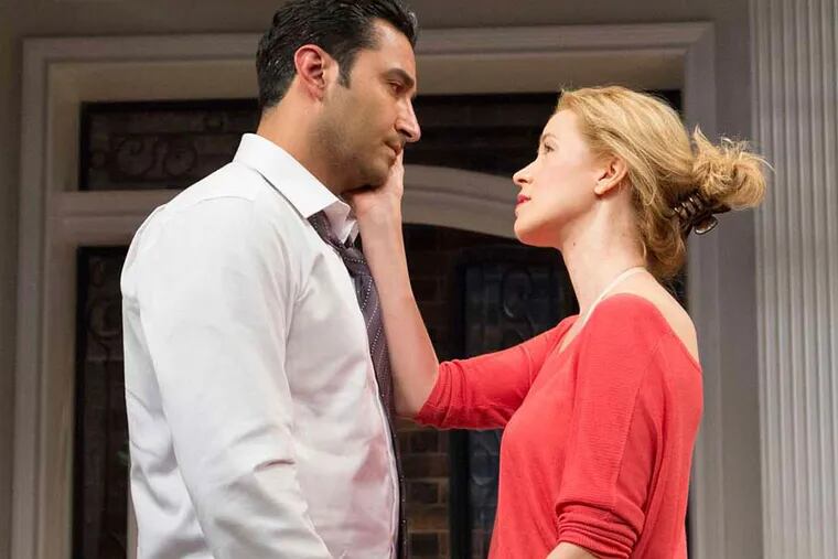From left to right: Pej Vahdat  as Amir and Monette Magrath as Emily in Philadelphia Theatre Company’s production of the Pulitzer Prize-winning drama "Disgraced" by Ayad Ahktar, running at the Suzanne Roberts Theatre through November 8. 
(Photo credit: Mark Garvin)