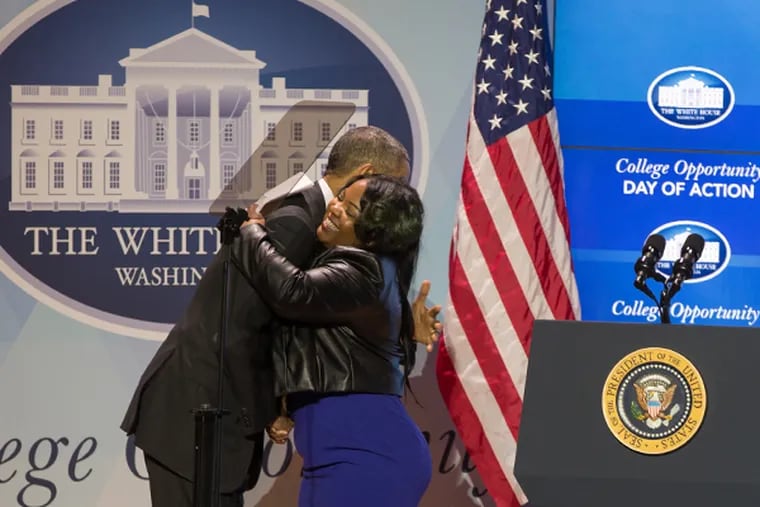 Chionque Mines hugging President Barack Obama. (PROVIDED)