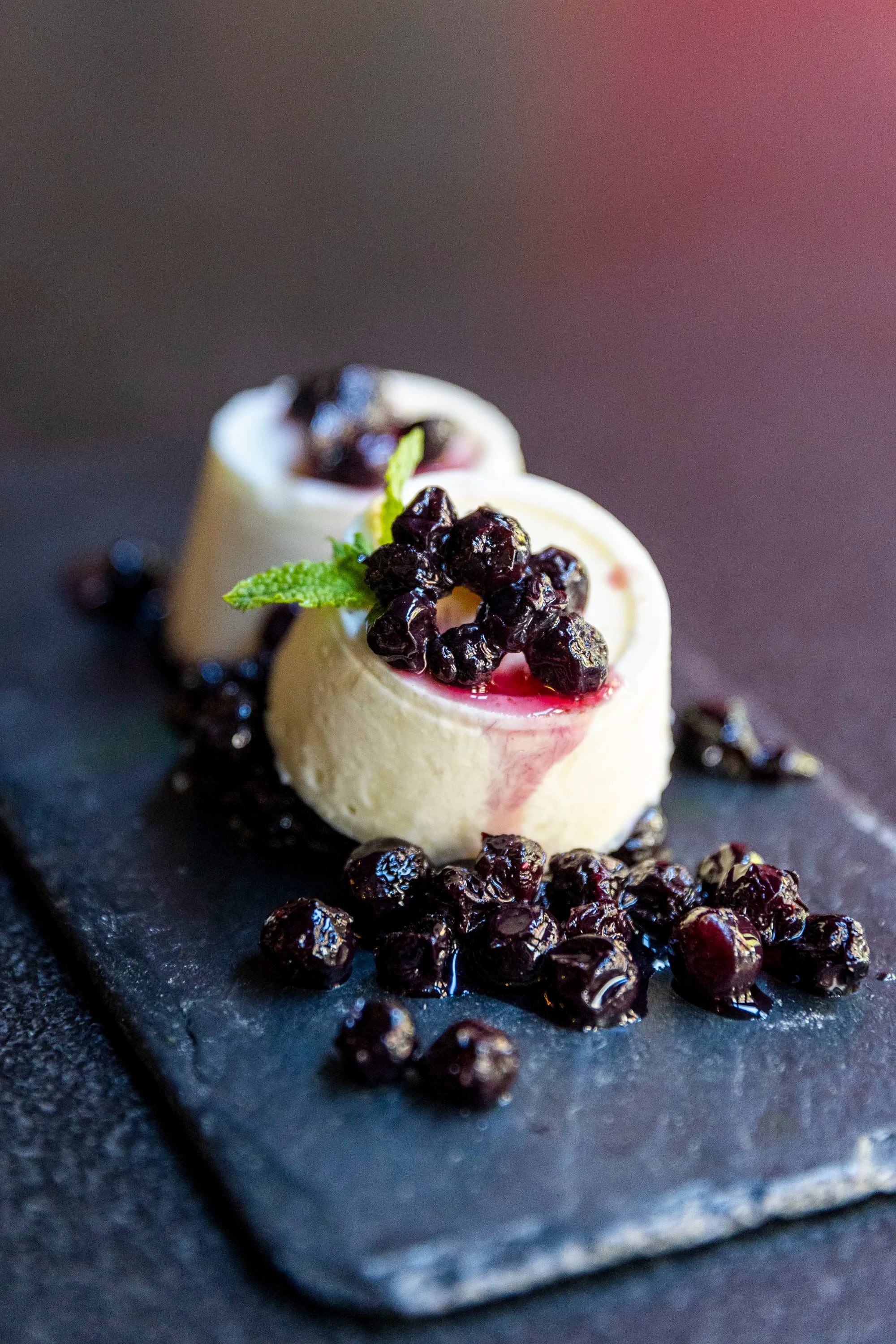 A traditional Indian ice cream (malai kulfi) topped with poached blueberries and creme-de-cassis, at Veda.