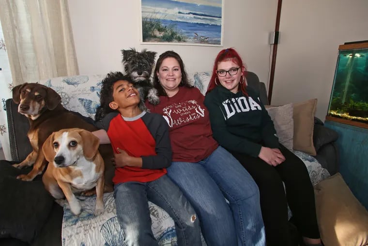 MaryJo Delaney with her children Xzavier Haroulakis, 10, and BrookLynn Delaney, 14, at their home in Lock Haven, Pa., on March 9, 2021. MaryJo Delaney and her attorney have filed a lawsuit against her former employer Advantage Sales Ltd, of Lock Haven, Pa. and owner Micah Clausen charging violations of the Families First Coronavirus Response Act. The firm says she was demoted due to poor performance.