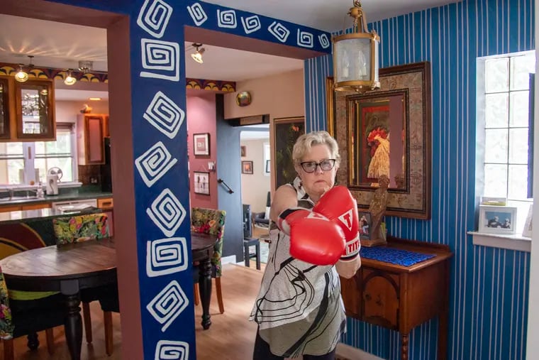 Boxing is part of Bonnie Queen's physical therapy for Parkinson's disease. She's an artist who has filled her home with color and design.