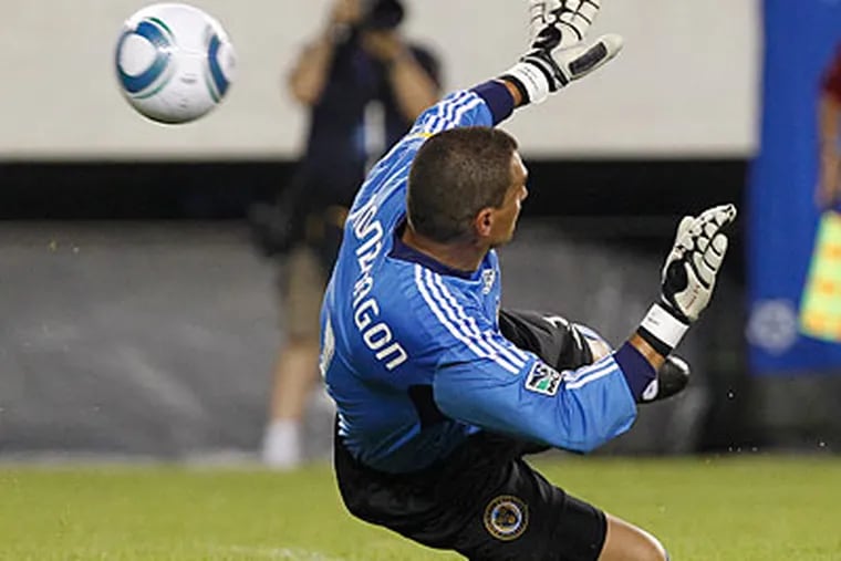 Union goalie Faryd Mondragon couldn't stop two Real Madrid goals in the game's first 10 minutes. (Ron Cortes/Staff Photographer)