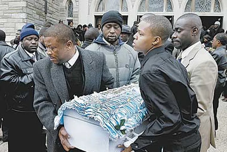 Pallbearers are bringing out Zyhire Wright-Teah's casket after the funeral service at the Divine Mercy Parish in West Philly on Saturday. (Akira Suwa / Staff Photographer ).