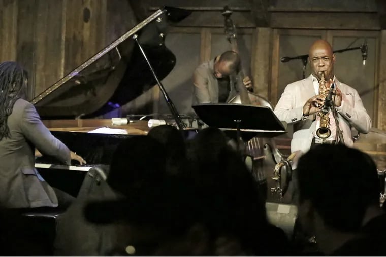 George Burton on piano, Nimrod Speaks on bass, Tim Warfield on saxophone, and Corey Rawls on drums at Chris' Jazz Cafe. The club is marking its silver anniversary - 25 years in the business.