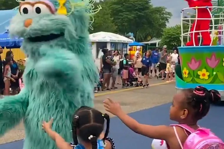 In this image from video provided by Jodi Brown, posted to Instagram on July 16, a performer dressed as the character Rosita waves off Brown's daughter and another 6-year-old Black girl at the Sesame Place amusement park in Langhorne, Pa.