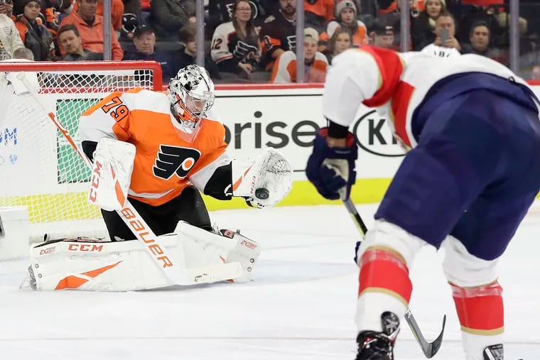 Flyers goaltender Carter Hart gloves a shot by Florida's Jayce Hawryluk last season, his first full year in the NHL.