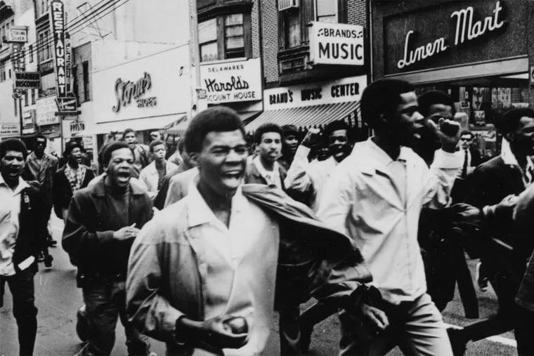 Angry Wilmington citizens march down Market Street in 1968. There was a nine-month occupation of the city after two nights of violence.