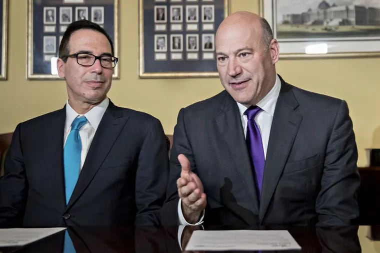 Gary Cohn, director of the U.S. National Economic Council (right) speaks as Treasury Secretary Steven Mnuchin during a meeting with members of the Senate Finance Committee at the U.S. Capitol in Washington, on Nov. 9, 2017.