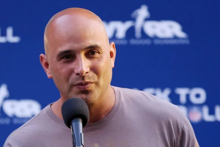FILE – In this Aug. 30, 2012, file photo, Craig Carton talks during the National Football League Back to Football Run at Central Park in New York. Federal officials said the New York sports radio host is in custody and details of the charges against the host of WFAN-AM’s “Boomer and Carton” show were not immediately made public Wednesday, Sept. 6, 2017.