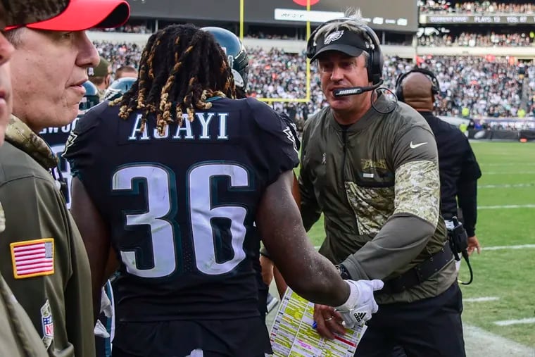Doug Pederson with Jay Ajayi. There was a lot to celebrate Sunday. CLEM MURRAY / Staff Photographer