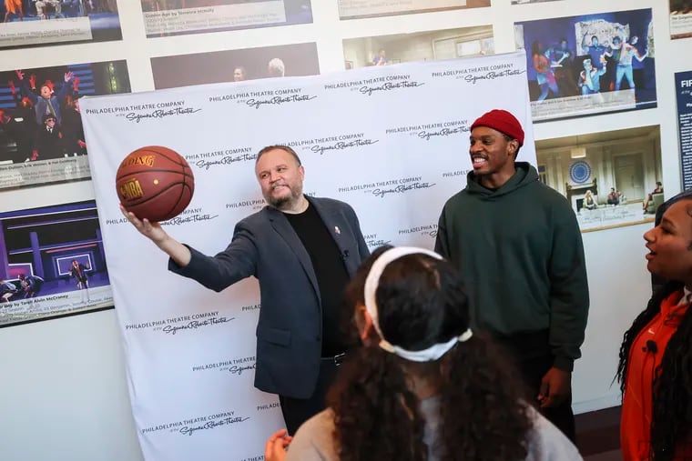 Daryl Morey, president of basketball operations of the 76ers, shows off his skills with the basketball to cast members including Colby Lewis before a developmental reading of his musical play, “Small Ball,” at the Suzanne Roberts Theatre on Dec. 13.