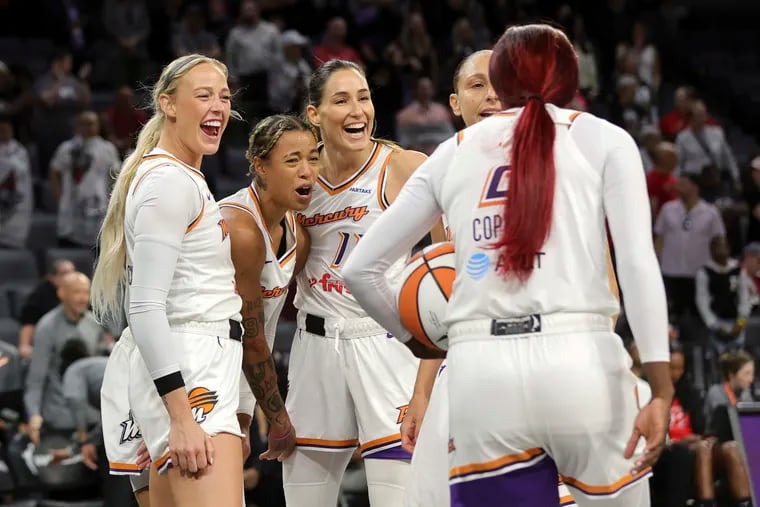 Natasha Cloud (center) alongside Phoenix Mercury teammates Sophie Cunningham, Rebecca Allen, and Diana Taurasi, celebrate Kahleah Copper drawing a foul. In their short time in Phoenix, Cloud and Copper have had a big impact on the squad.