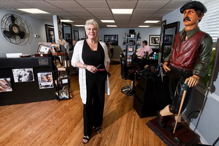 Donna Brosious, barber, inside her Boardroom Barbershop, in the center of Medford, N.J.