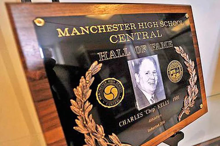 Chip Kelly's school hall-of-fame plaque is seen on display a trophy case at Manchester High School Central. (Photo by: David Lane/Union Leader)