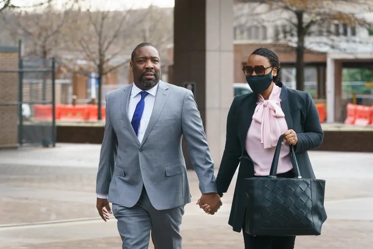 Kenyatta Johnson, left, and his wife Dawn Chavous, right, arrive at federal court in Philadelphia on Tuesday.