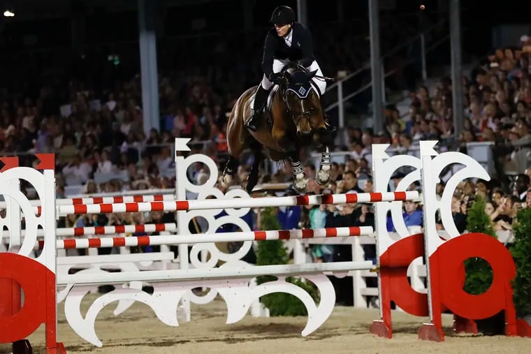 HH Azur rode by McLain Ward jumps over a fence during a jump-off in the Sapphire Grand Prix of Devon at the Devon Horse Show and County Fair  on May 30, 2019.  Ward won the cometition.