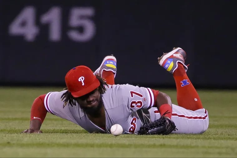 Phillies outfielder Odubel Herrera watches the ball drop in front of him during Tuesday's loss to the Rockies.