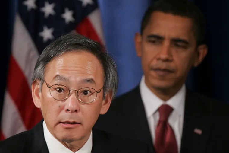 President-elect Barack Obama listens as Energy Secretary- designate Steven Chu, a Nobel winner, talks to reporters.