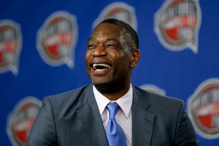 Former NBA basketball player Dikembe Mutombo laughs during a news conference announcing him as one of the 12 finalists of the 2015 hall of fame class.