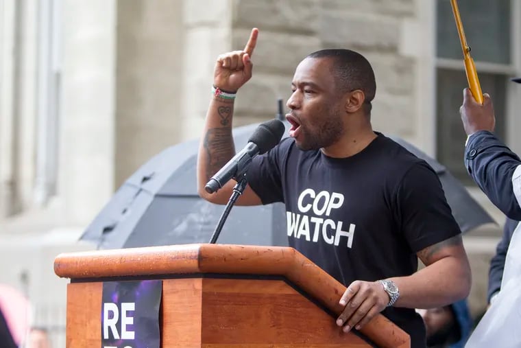 Dr.Marc Lamont Hill, shown at a rally, wsa fired by CNN over a speech.