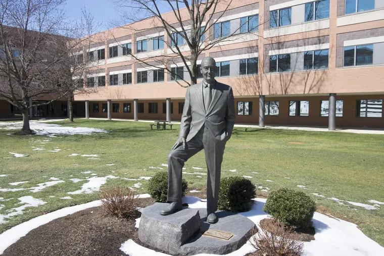 A statue of Vanguard founder Jack Bogle in a courtyard on the company’s Malvern campus.