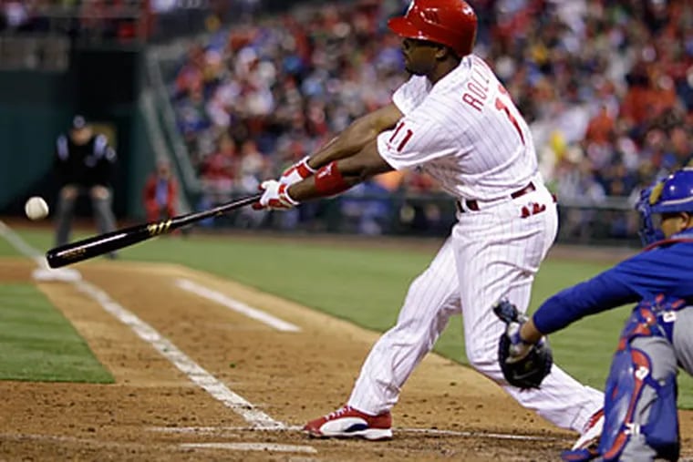 Phillies shortstop Jimmy Rollins hits a two-run double in the fourth inning on Saturday. (Matt Slocum/AP)